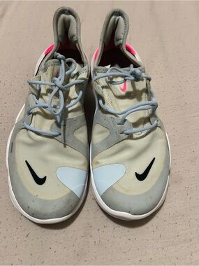 Nike Beige Athletic Sneakers with Light Blue Details and Pink Accents
